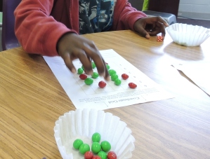 After rolling dice to create an ordered pair, students got to grab the candy if they could plot the points!